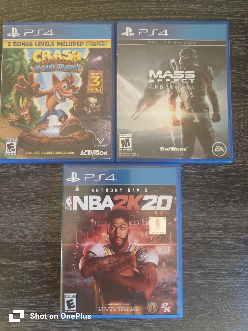 Lot 3 PS4 Games Mass Effect, NBA2K20,Craah Bandicoot